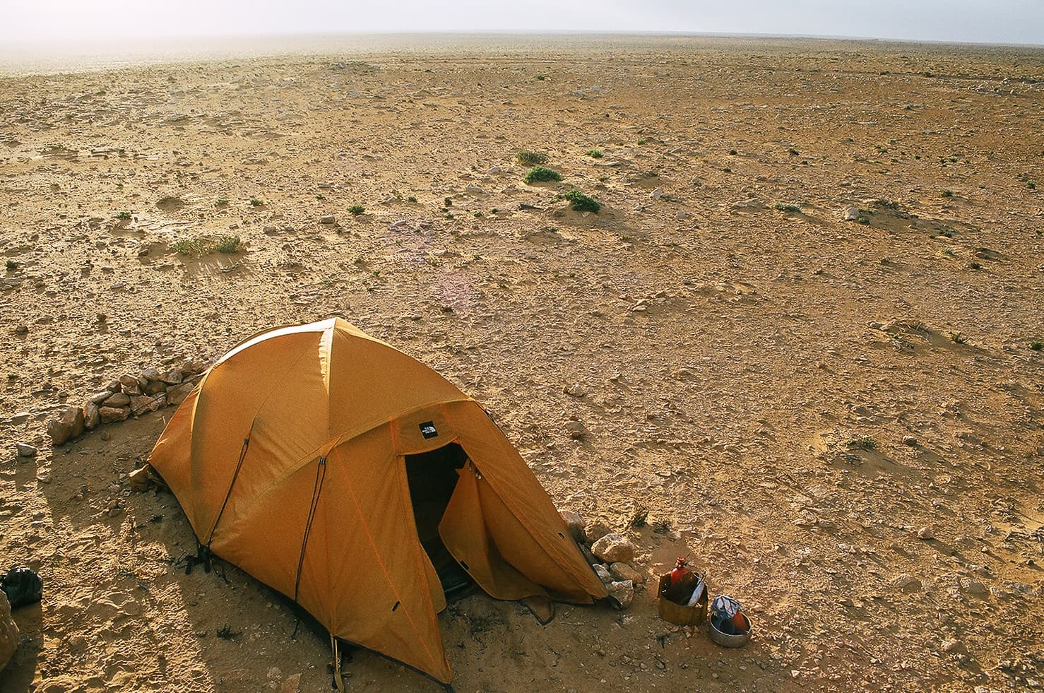 Luxury desert camp in the Moroccan Sahara at dusk